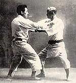 Jigoro Kano (right) practicing Judo with Kyuzo Mifune, 10th dan